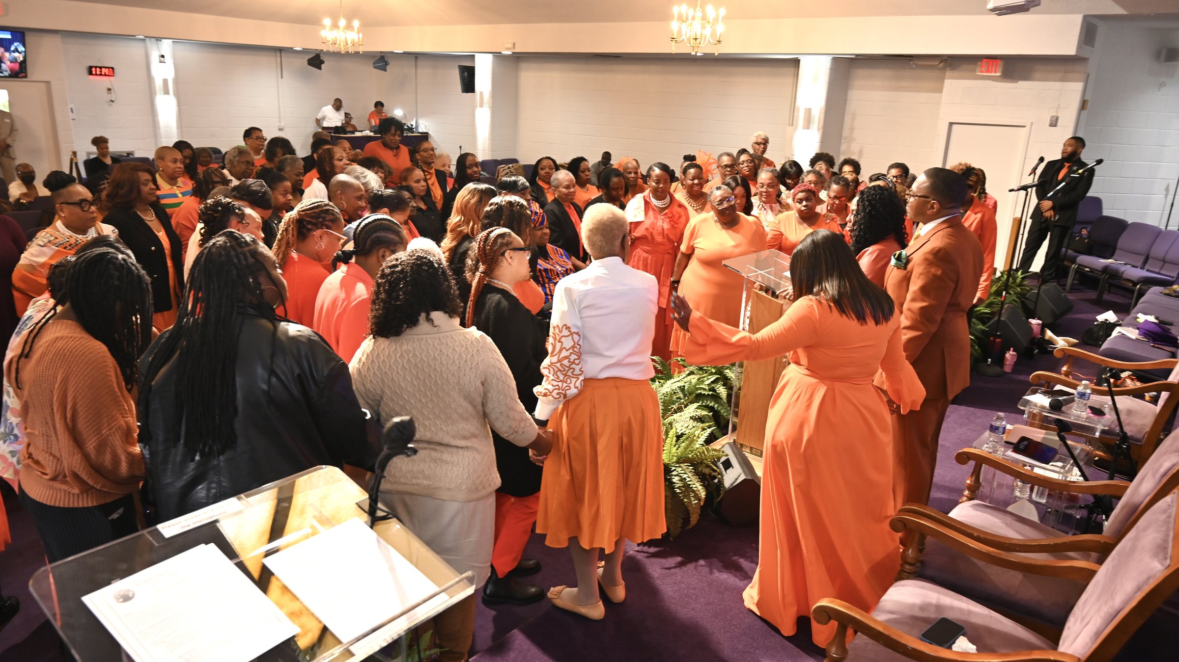The congregation gathered at the altar during a Women's Day service.
